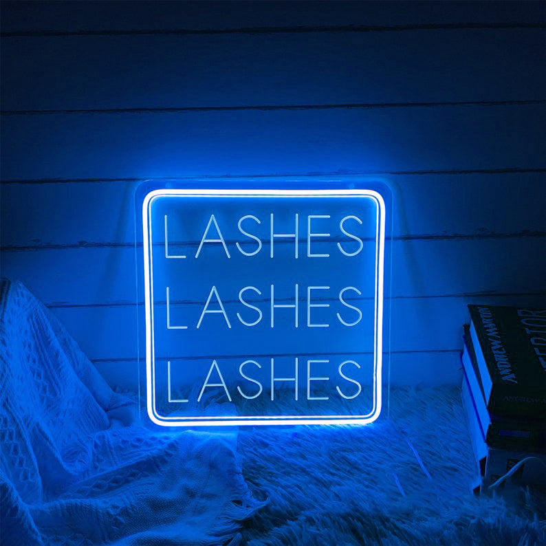 Lashes Lashes Lashes Neon, Neon sign, Beauty salon decor, Eyelash extensions, Lash-centric salon, Vibrant lighting, Stylish ambiance, Illuminated sign, Trendy neon sign, Chic beauty studio, Salon atmosphere, Lash artist pride, Eyelash obsession.