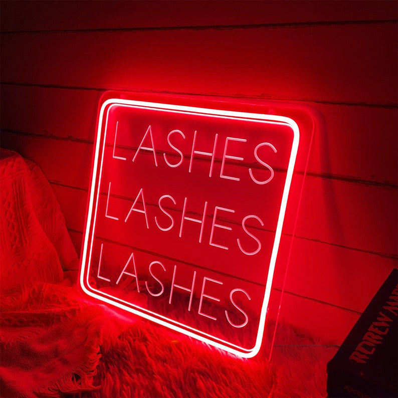Lashes Lashes Lashes Neon, Neon sign, Beauty salon decor, Eyelash extensions, Lash-centric salon, Vibrant lighting, Stylish ambiance, Illuminated sign, Trendy neon sign, Chic beauty studio, Salon atmosphere, Lash artist pride, Eyelash obsession.